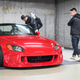 People appreciating cars